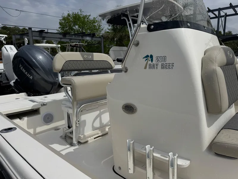 Slide: The Image of 2025 Key West 210 Bay Reef boat with Yamaha engine, featuring comfortable seating and sleek design. - 17