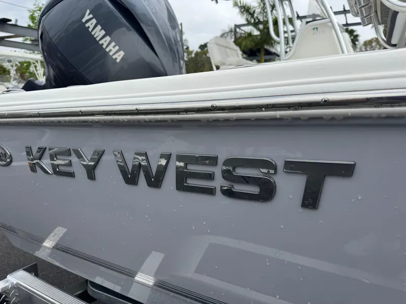 Slide: The Image of 2025 Key West 210 Bay Reef boat with Yamaha engine, close-up view. - 4