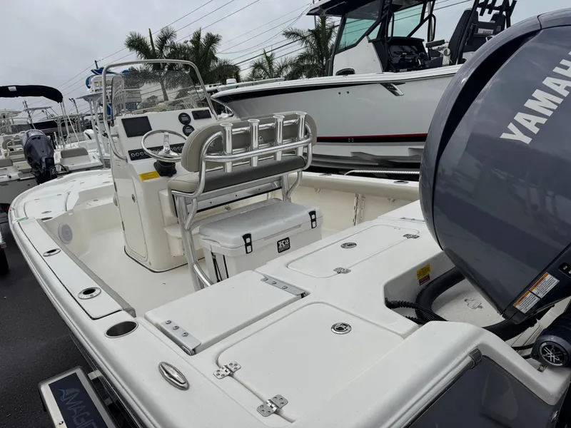 Slide: The Image of 2025 Key West 210 Bay Reef boat with Yamaha engine, docked outdoors. - 8