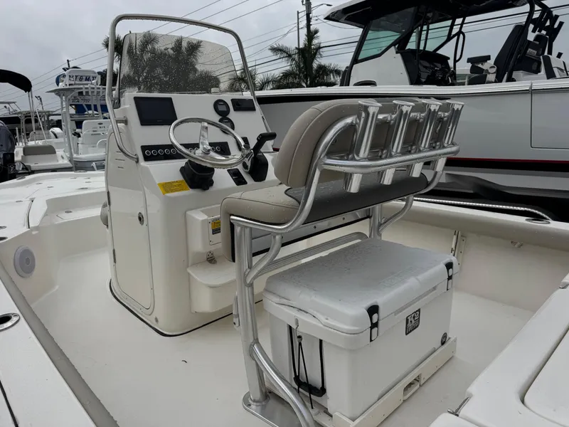 Slide: The Image of 2025 Key West 210 Bay Reef boat interior with steering console and seating. - 9