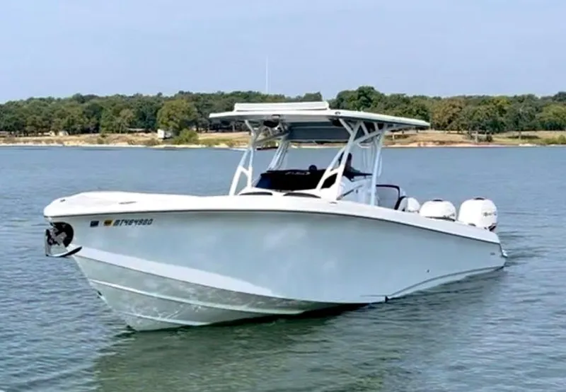 The Image of 2019 Nor-Tech 340 Sport Center Console boat on calm water. - 0