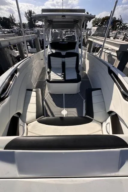Slide: The Image of 2019 Nor-Tech 340 Sport Center Console boat with sleek seating and modern design. - 12