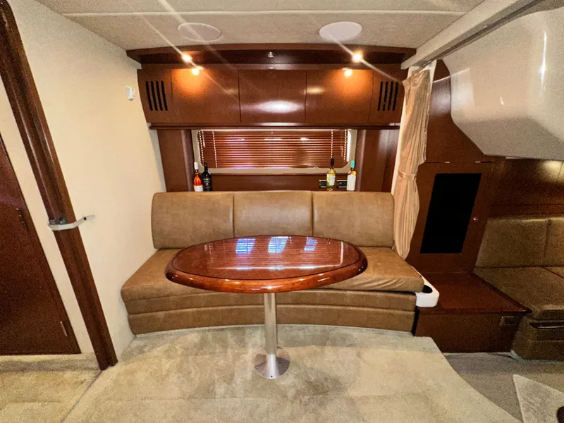 Slide: The Image of Luxurious 2007 Sea Ray 380 Sundancer interior with elegant seating and wooden table. - 20
