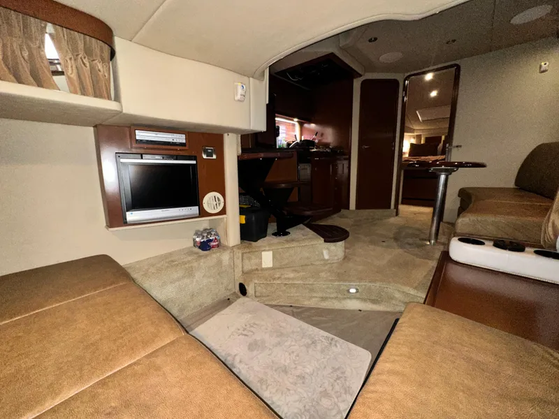 Slide: The Image of Interior of 2007 Sea Ray 380 Sundancer yacht with cozy seating and entertainment area. - 24