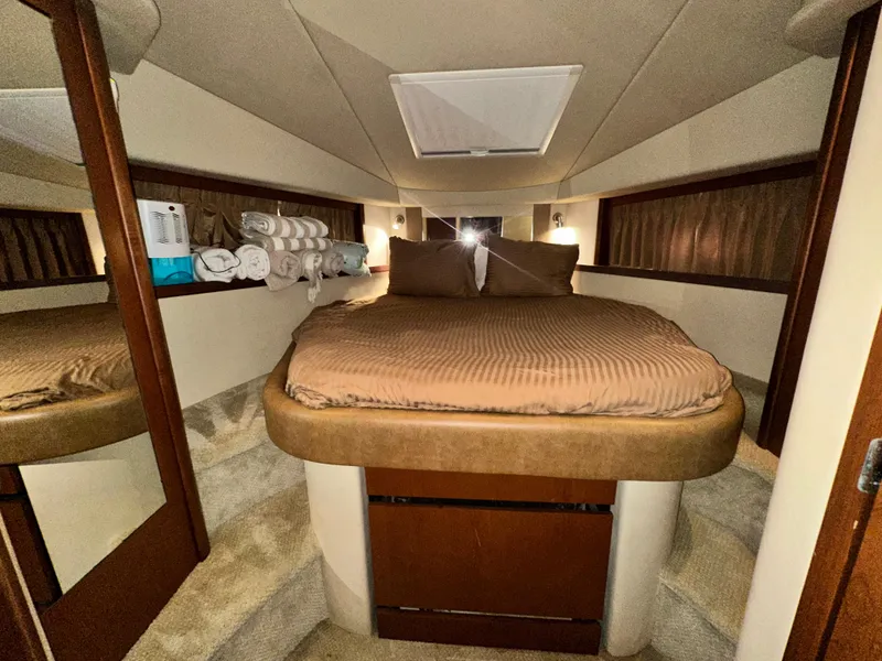 Slide: The Image of Luxurious cabin interior of 2007 Sea Ray 380 Sundancer yacht with cozy bedding. - 27