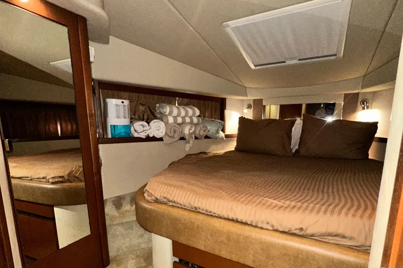 Slide: The Image of Luxurious cabin interior of 2007 Sea Ray 380 Sundancer yacht with cozy bedding. - 28