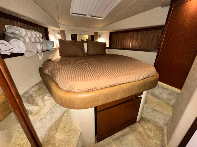 Slide: The Image of Luxurious cabin interior of 2007 Sea Ray 380 Sundancer yacht with cozy bedding. - 29