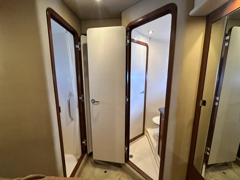 Slide: The Image of Interior of 2007 Sea Ray 380 Sundancer yacht bathroom with shower and toilet. - 33