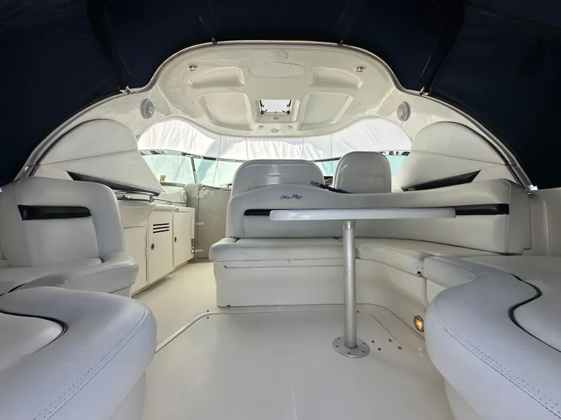 Slide: The Image of 2007 Sea Ray 380 Sundancer interior with white seating and table, showcasing luxury yacht design. - 5