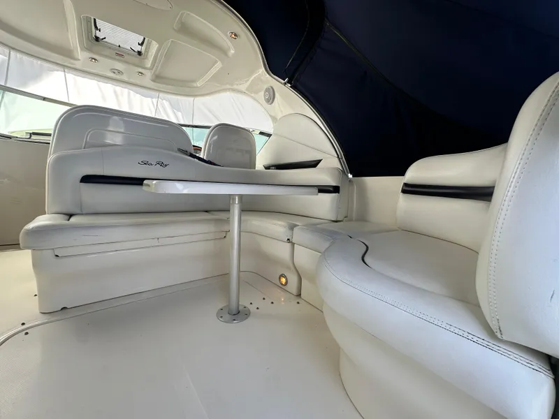 Slide: The Image of 2007 Sea Ray 380 Sundancer interior with white seating and table. - 7