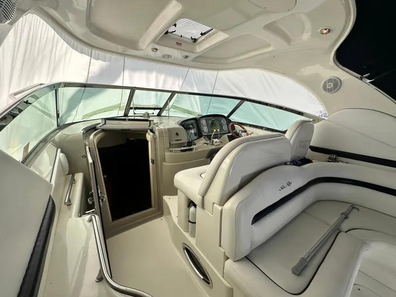 Slide: The Image of Interior of 2007 Sea Ray 380 Sundancer yacht with luxurious seating and helm. - 9