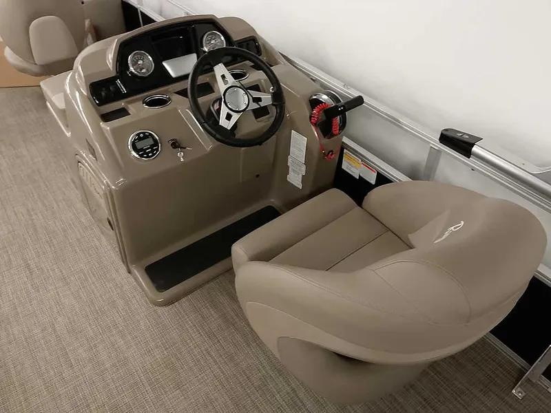Slide: The Image of 2023 Ranger Reata 200F Pontoon boat helm with steering wheel and captain's chair. - 15