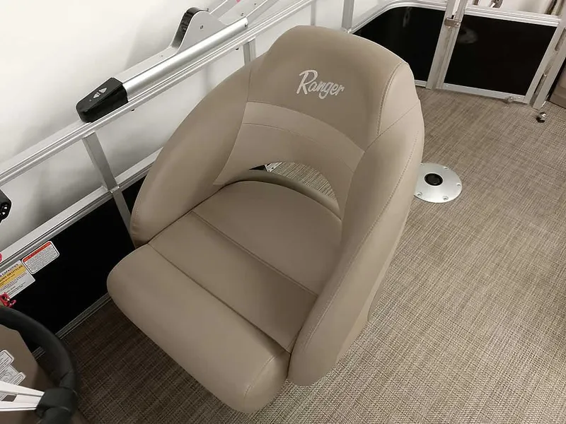 Slide: The Image of 2023 Ranger Reata 200F Pontoon boat seat, beige upholstery, sleek design. - 16