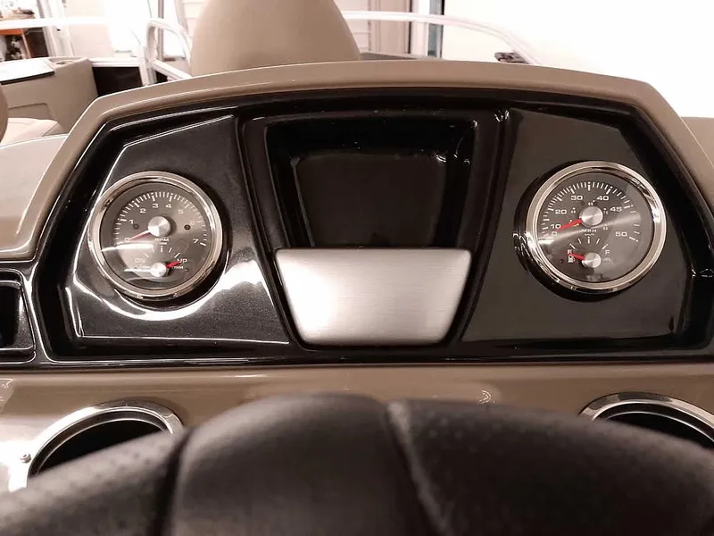 Slide: The Image of Dashboard of 2023 Ranger Reata 200F Pontoon with gauges and steering wheel. - 19