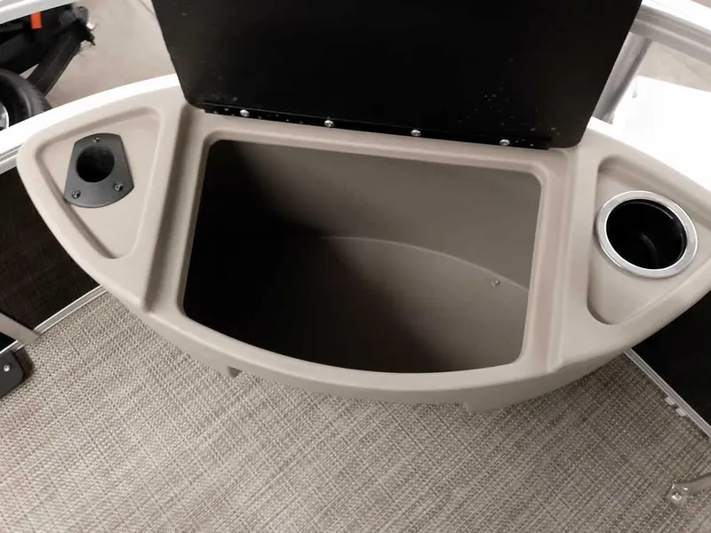 Slide: The Image of 2023 Ranger Reata 200F Pontoon storage compartment with cup holder and speaker mount. - 25