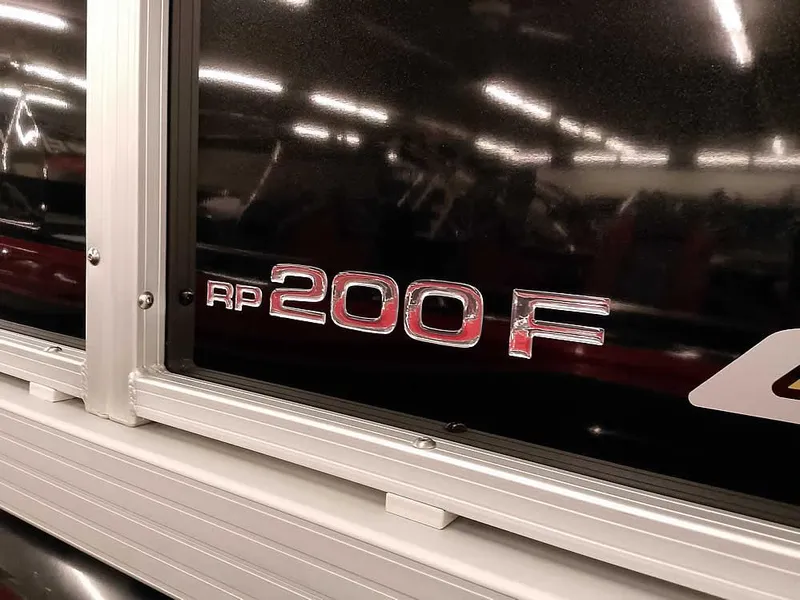 Slide: The Image of 2023 Ranger Reata 200F Pontoon logo on boat exterior. - 4