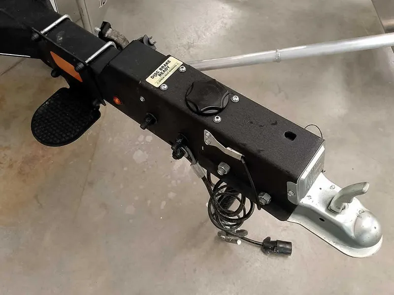 Slide: The Image of Trailer hitch of 2023 Ranger Reata 200F Pontoon on concrete floor. - 5