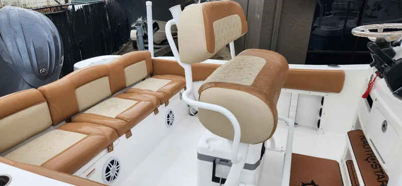 Slide: The Image of 2025 NauticStar 212 Legacy boat interior with tan and cream seating. - 3