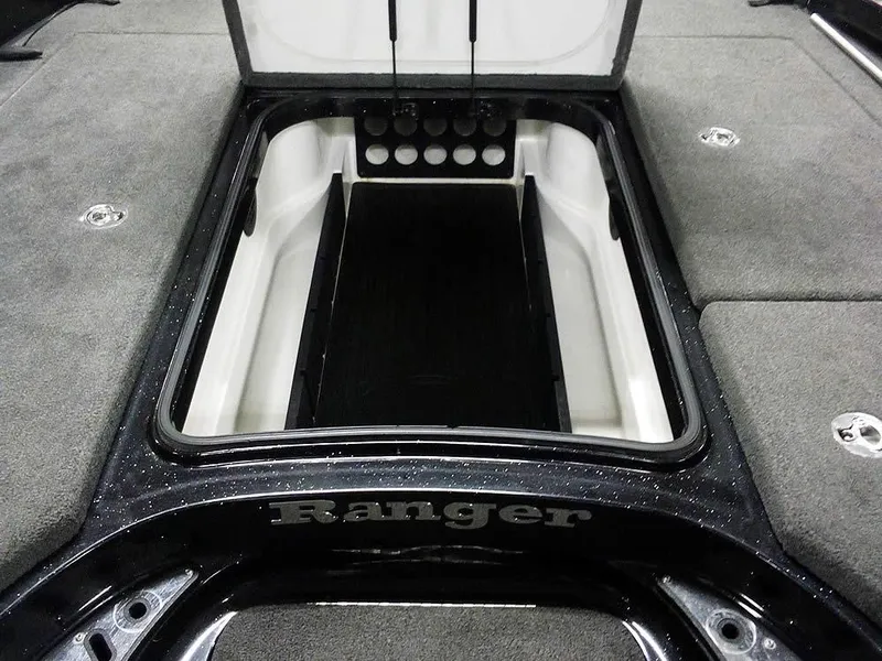 Slide: The Image of 2013 Ranger Z520C Comanche boat storage compartment, open with carpeted interior. - 15