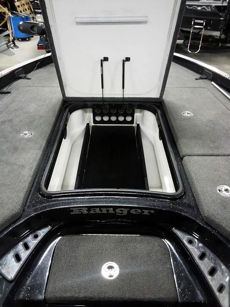 Slide: The Image of 2013 Ranger Z520C Comanche boat storage compartment open, showcasing interior space. - 16