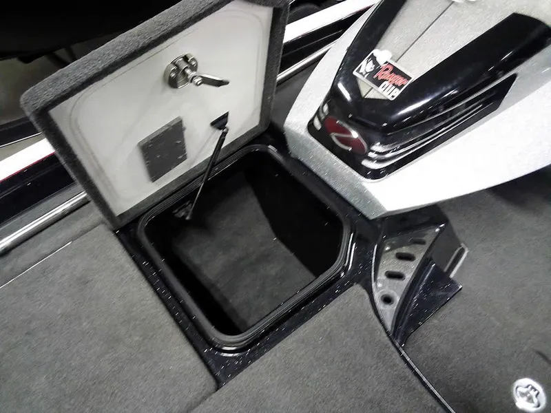 Slide: The Image of 2013 Ranger Z520C Comanche boat storage compartment with open lid and secure latch. - 17