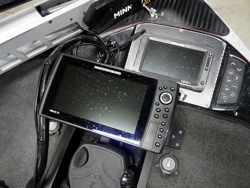 Slide: The Image of 2013 Ranger Z520C Comanche boat dashboard with Humminbird and Lowrance electronics. - 22