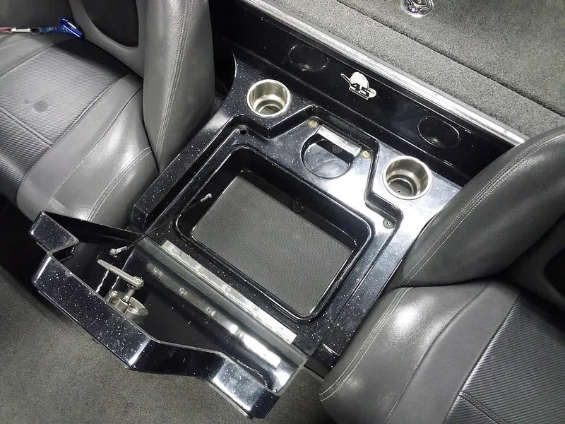 Slide: The Image of 2013 Ranger Z520C Comanche interior with cup holders and storage compartment. - 29