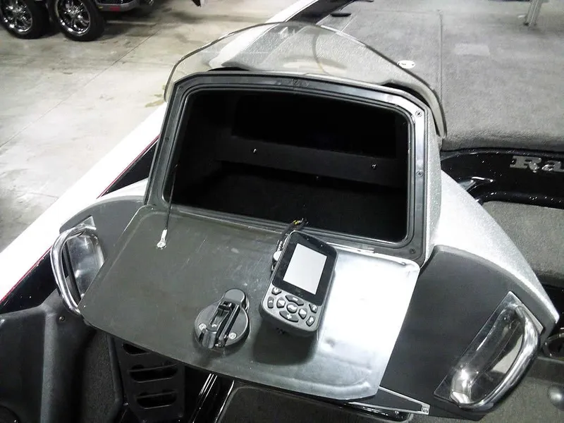 Slide: The Image of 2013 Ranger Z520C Comanche dashboard with electronic device and storage compartment. - 32