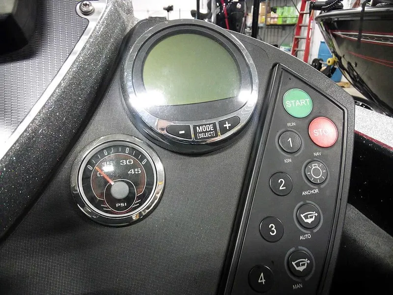 Slide: The Image of Control panel of a 2013 Ranger Z520C Comanche boat with gauges and buttons. - 39