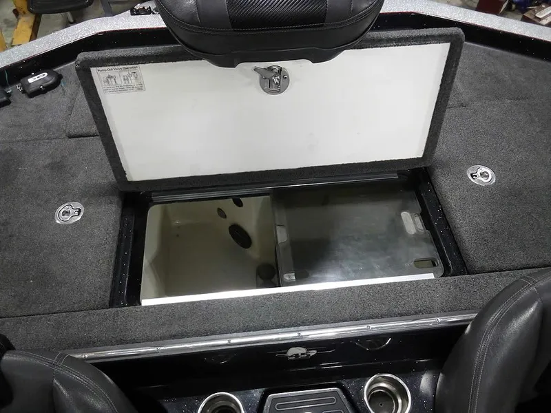 Slide: The Image of 2013 Ranger Z520C Comanche boat storage compartment with open lid, showcasing interior space. - 40