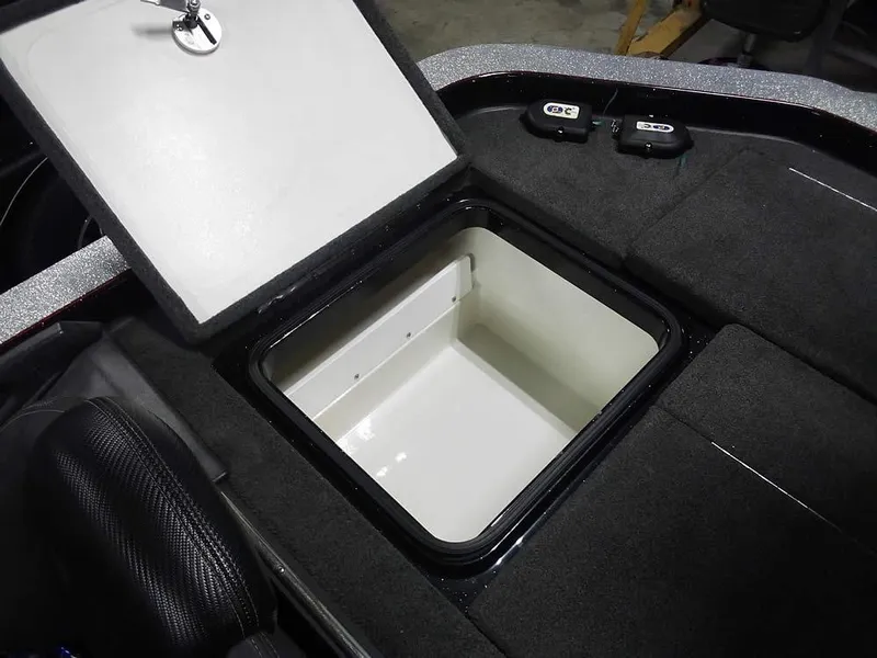 Slide: The Image of 2013 Ranger Z520C Comanche storage compartment with open lid, showcasing interior space. - 42