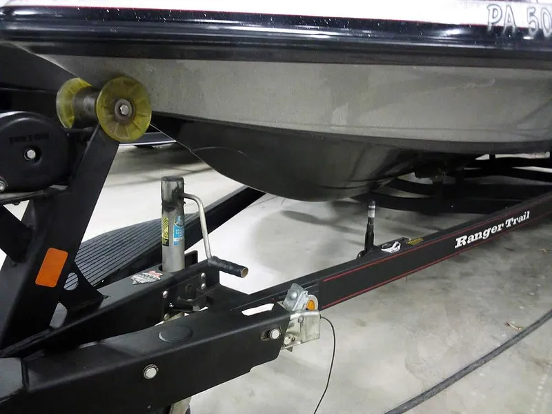 Slide: The Image of 2013 Ranger Z520C Comanche boat on trailer, close-up view of hull and hitch. - 45