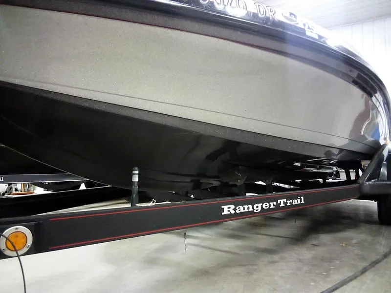 Slide: The Image of 2013 Ranger Z520C Comanche boat on Ranger Trail trailer in a garage. - 7