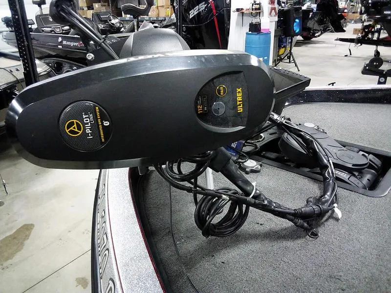 Slide: The Image of 2013 Ranger Z520C Comanche boat with Ultrex trolling motor in a garage setting. - 8