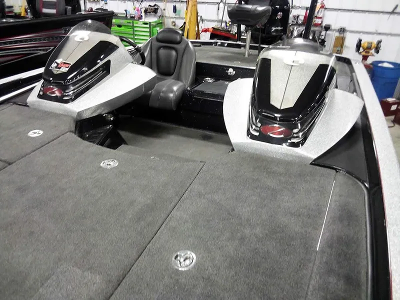 Slide: The Image of 2013 Ranger Z520C Comanche boat interior with dual consoles and seating. - 9