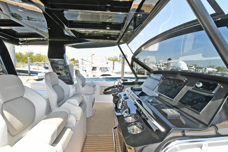 Slide: The Image of 2022 Pardo Yachts 50 Walkaround cockpit with modern controls and luxurious seating. - 21