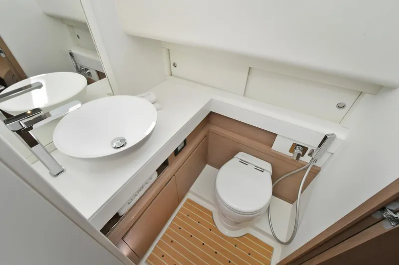Slide: The Image of 2022 Pardo Yachts 50 Walkaround bathroom with modern sink and toilet. - 38