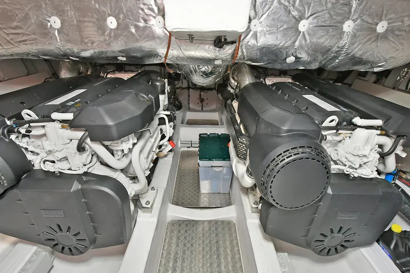 Slide: The Image of Engine room of 2022 Pardo Yachts 50 Walkaround, featuring dual engines and insulated surroundings. - 45