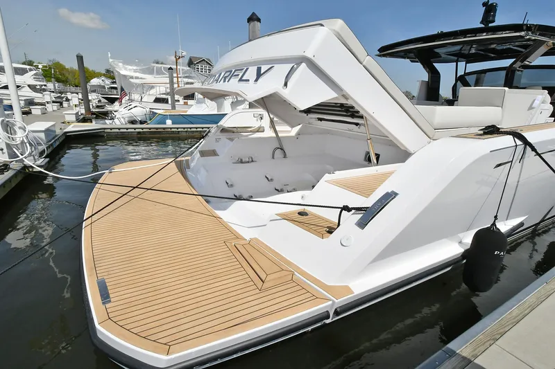Slide: The Image of 2022 Pardo Yachts 50 Walkaround docked, showcasing sleek design and spacious deck. - 7
