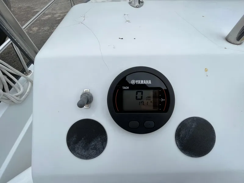 Slide: The Image of Yamaha tachometer on 1994 Boston Whaler 15 Dauntless boat dashboard. - 12