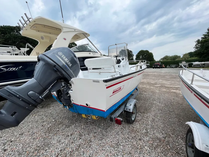 Slide: The Image of 1994 Boston Whaler 15 Dauntless boat with Yamaha outboard motor on a trailer. - 6