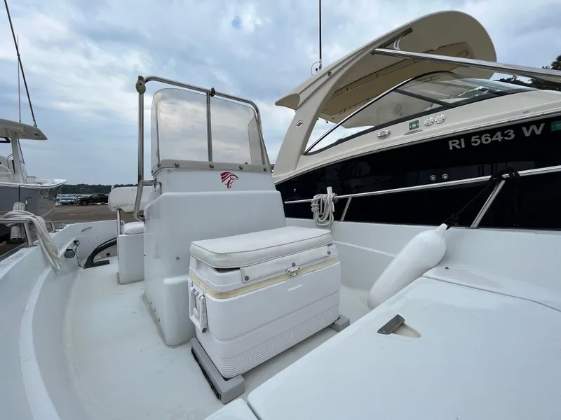 Slide: The Image of 1994 Boston Whaler 15 Dauntless boat interior with seating and console. - 9