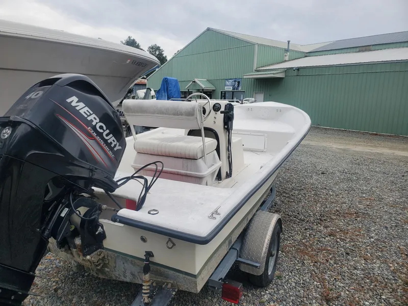 Slide: The Image of 2018 May-Craft 1700 Skiff with Mercury outboard motor on trailer. - 3
