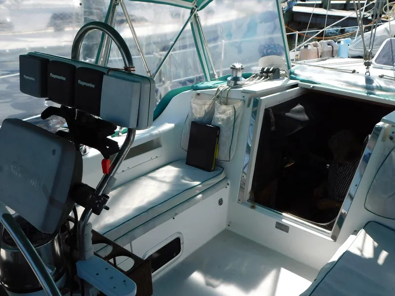 Slide: The Image of Cockpit of a 1998 Catalina 34 Mark II sailboat with navigation equipment. - 12