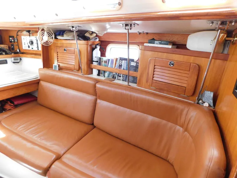 Slide: The Image of Interior of 1998 Catalina 34 Mark II sailboat with leather seating and wooden cabinetry. - 18
