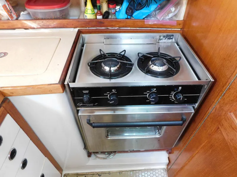 Slide: The Image of Stainless steel stove and oven in a 1998 Catalina 34 Mark II yacht kitchen. - 22