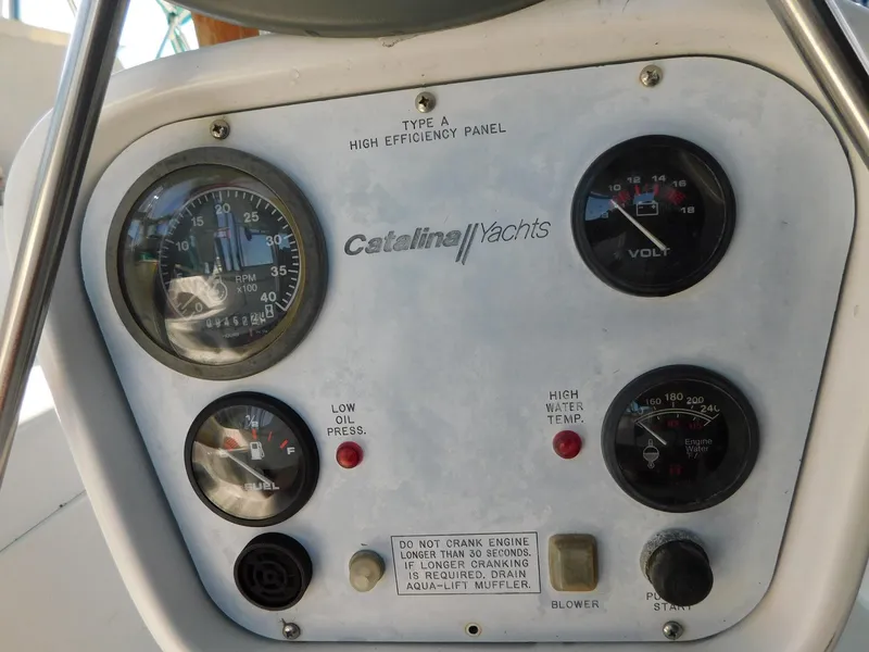 Slide: The Image of Control panel of a 1998 Catalina 34 Mark II yacht with gauges and indicators. - 7