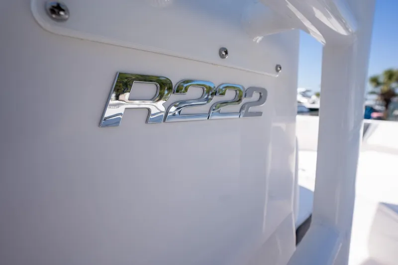 Slide: The Image of 2025 Robalo R222 boat emblem on white surface, close-up view. - 14