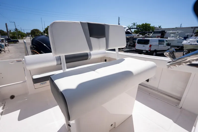 Slide: The Image of 2025 Robalo R222 boat interior with sleek seating and modern design. - 17