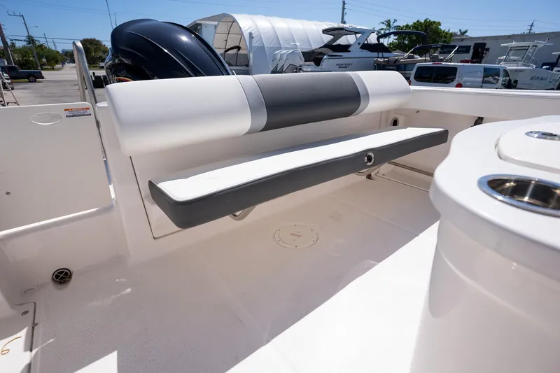 Slide: The Image of 2025 Robalo R222 boat interior with cushioned seating and storage. - 20